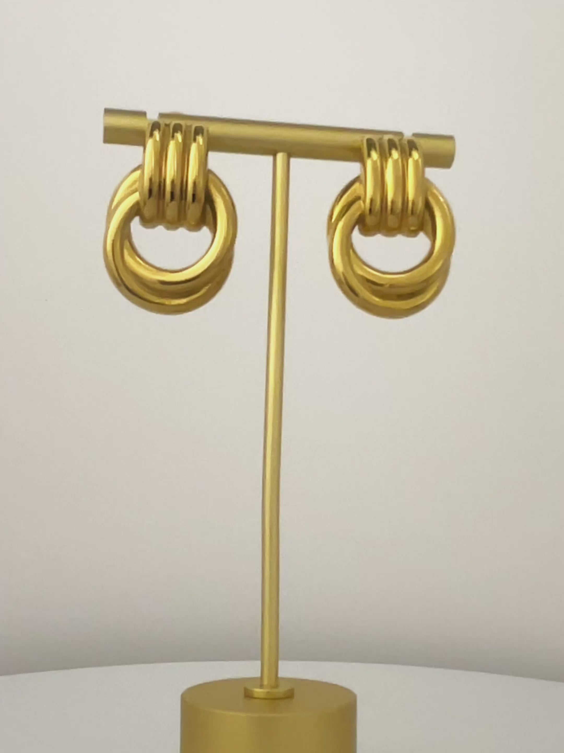 360-degree view of gold Amara Knot Earring, large vintage-inspired earrings for women, hypoallergenic statement jewelry.
